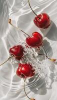 Red cherries with water splash on white background. photo