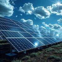 Large solar farm producing clean renewable energy under a blue sky. photo