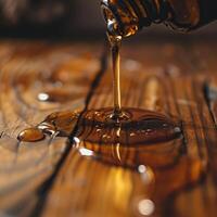 Honey being poured from a jar. photo