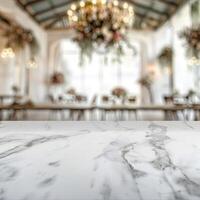 Elegant marble table with blurred background of a wedding reception. photo