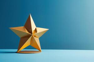 gold star on a blue background. The star is three-dimensional and has a shiny surface. The background is a dark blue color, which makes the star stand out. photo