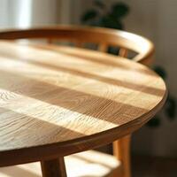 An empty wooden table with sunlight shining on it. photo