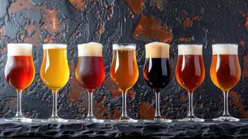 Craft beers in different glasses on a dark background. photo