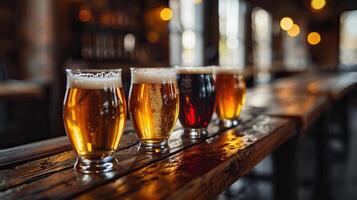 A flight of five craft beers sit on a wooden bar. photo
