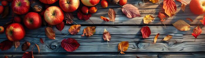 A dynamic angle capturing a festive scene of apples, pumpkins, and autumn leaves spread across a weathered wooden deck, vibrant colors in focus, set against a clean, minimalist bac photo