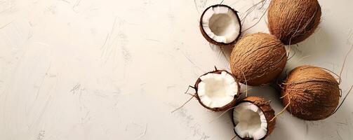 milky white background with three coconuts, a lot of empty space photo