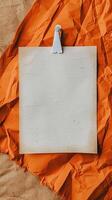 a close up of a glamping bulletin board of an blank piece of paper in the center, orange and white color theme photo