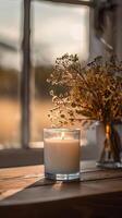 white candle in a 9oz glass candle jar photo