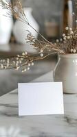 white blank notice invitation paper on a table photo
