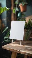 a5 white card standing ontop of a desk, product image photo