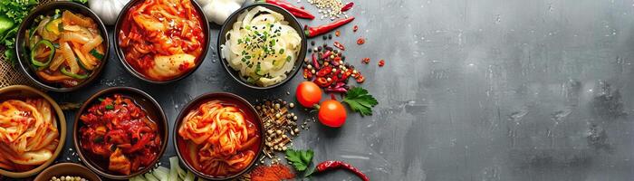 kimchi feast, featuring several types of kimchi laid out on a stark white table, broad space on the left for promotional text. photo