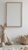 blank wooden picture frame on a white wall in a kids playroom neutral colors photo