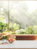 A marble white kitchen tabletop with a blurred background of a garden. photo