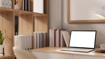 A close-up image of a laptop mockup on a wooden desk in a contemporary minimalist home office. photo