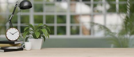 An office desk featuring a designated space against a blurred background of a modern office corridor photo