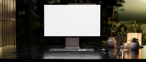 Modern dark workspace with a white-screen computer mockup and accessories arranged on a table. photo