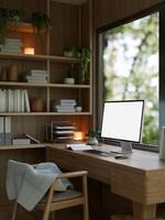 A modern, comfortable home office with a white-screen computer mockup on a wooden desk. photo