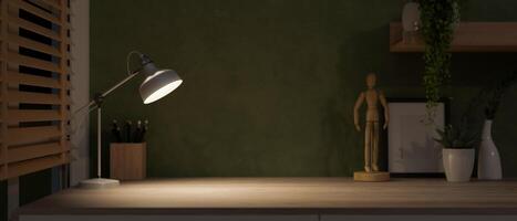 A copy space on a hardwood table with dim light from a table lamp, in a dark home office room. photo