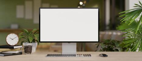 A modern and comfortable home office with a white-screen computer mockup on a hardwood desk. photo