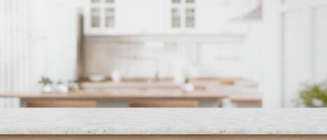 Marble counter top with empty space for display product with blurred background of a modern kitchen. photo