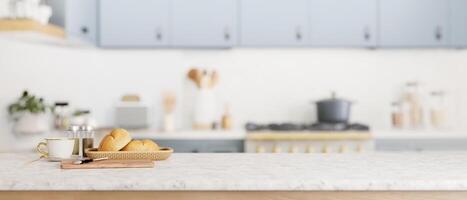 A copy space for display your product on a kitchen tabletop in a cozy minimal kitchen. photo
