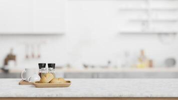 Marble counter top with blurred background of a minimal white kitchen. photo