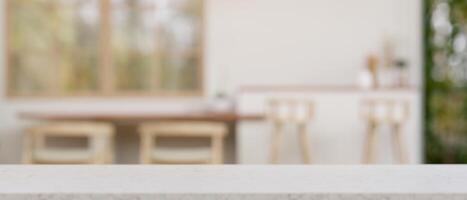 Empty mockup space on a white tabletop with a blurred background of a modern kitchen. photo