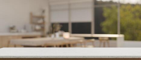 Empty space on a white tabletop with a blurred background of a modern kitchen with a dining table. photo