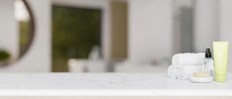 Toiletries and a copy space for display product on a white marble tabletop in a modern bathroom. photo