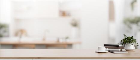 A tabletop with empty mockup space for display product with a blurred background of a modern kitchen photo