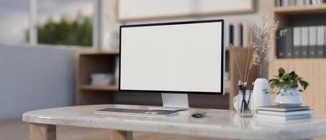 A computer white-screen mockup on a luxury marble table in a modern office or home office. photo