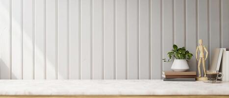 A white marble tabletop against the white plank wall features a space for display products. photo