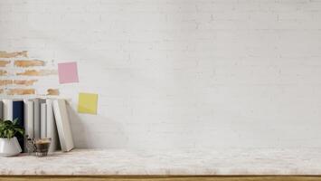 A display space on a white marble table showcases products against the white brick wall. photo