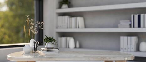 A copy space for displaying products on a marble table in a room with a large bookshelf. photo