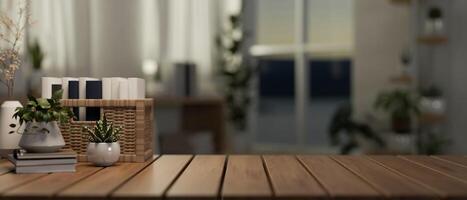 A wooden tabletop feature a copy space against a blurred background of a minimalist apartment room. photo