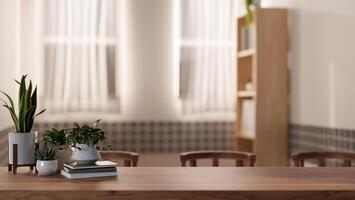 A space on a wooden tabletop features books and decorative plants in a cozy minimalist room. photo