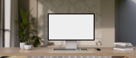 A desktop computer mockup and accessories on a wooden desk in a modern office room. photo