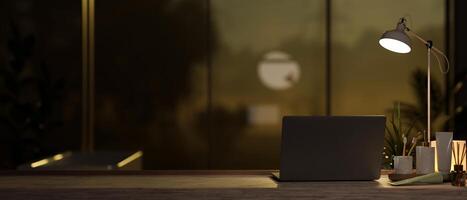 Laptop and a toiletry set on a tabletop in a modern, dark bathroom with dim light from a table lamp. photo