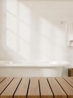 A space for showcasing products on a wooden table in a modern white bathroom featuring a bathtub. photo