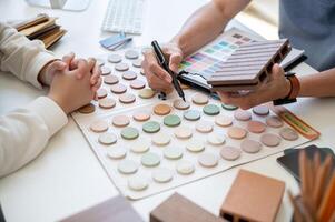 A close-up image of an expert interior designer or architect having a meeting with his client. photo