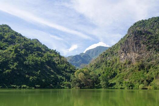 Scenic view landscape of pond with mountains background in Northern Thailand photo