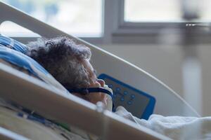 Elderly woman patients with lung disease, getting oxygen for treatment in the room at the hospital. Space for text. Concept of aged people and healthcare photo