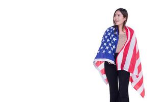 Young woman standing in the front view of the eye show and using the USA flag cover flag covering the shoulders with white background. Space for Text photo