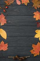 Background texture with old wooden table and yellow autumnal leaves. Autumn maple leaves on wooden background with copy space. Top view. photo