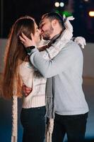 Date lovers in winter rink skates. Concept of Christmas holidays, caring for your loved one. photo