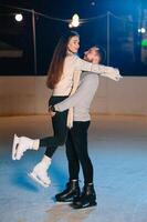 Date lovers in winter rink skates. Concept of Christmas holidays, caring for your loved one. photo