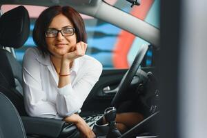 business woman in her new car photo