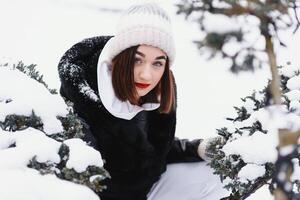 beautiful young woman in wintertime outdoor. Winter concept photo