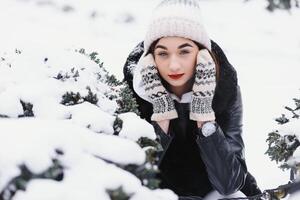 beautiful young woman in wintertime outdoor. Winter concept photo