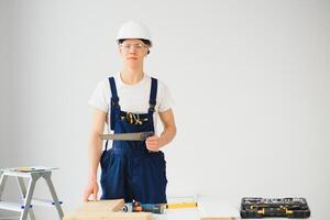 Builder in helmets on a white background photo